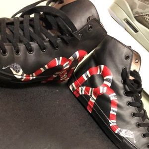 Leather snake print high top Gucci sneakers